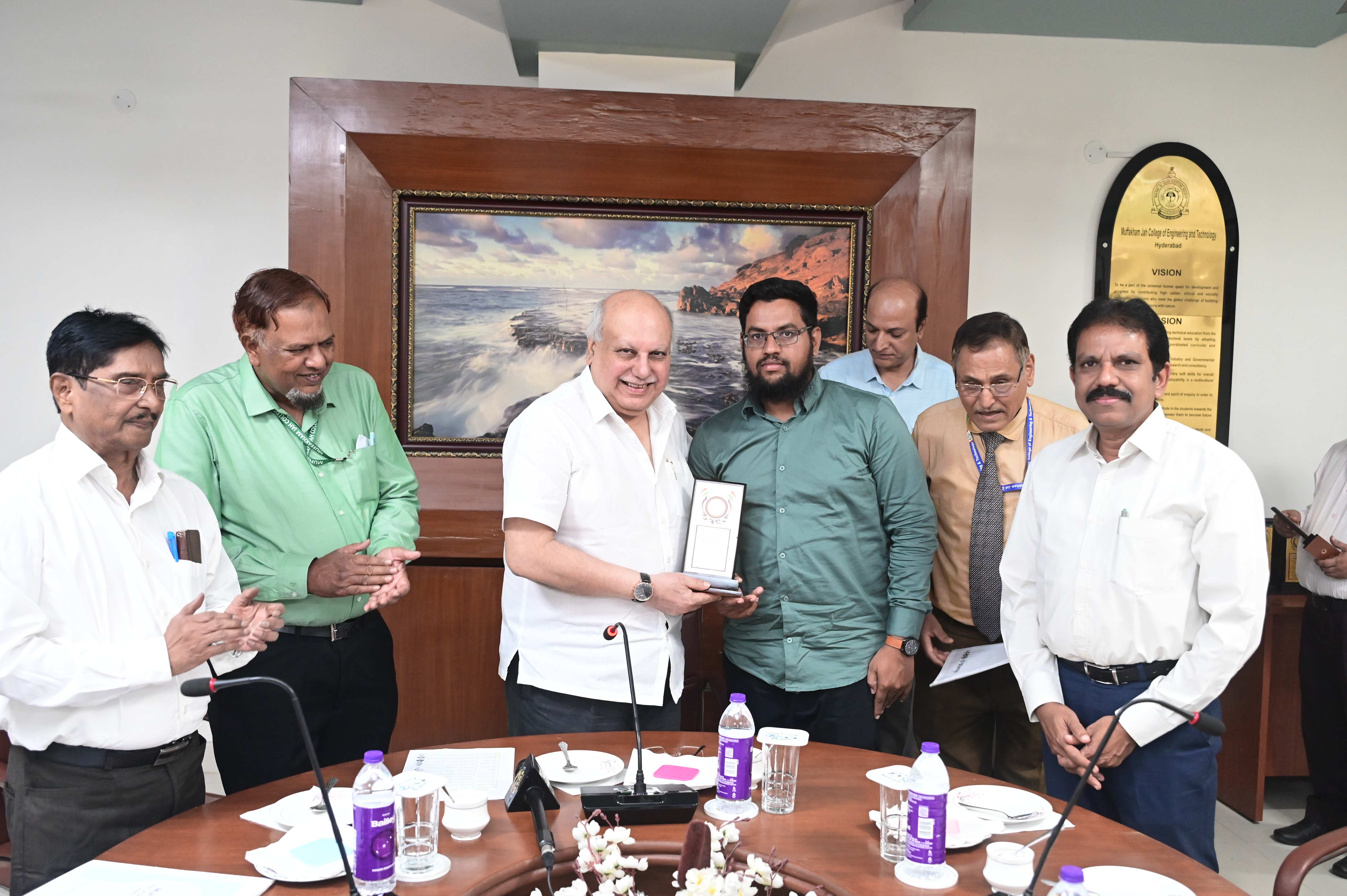 Mr. Shaik Arif Pasha, AEE receiving memento from Hon. Secretary Janab Zafar Javeed, SUES